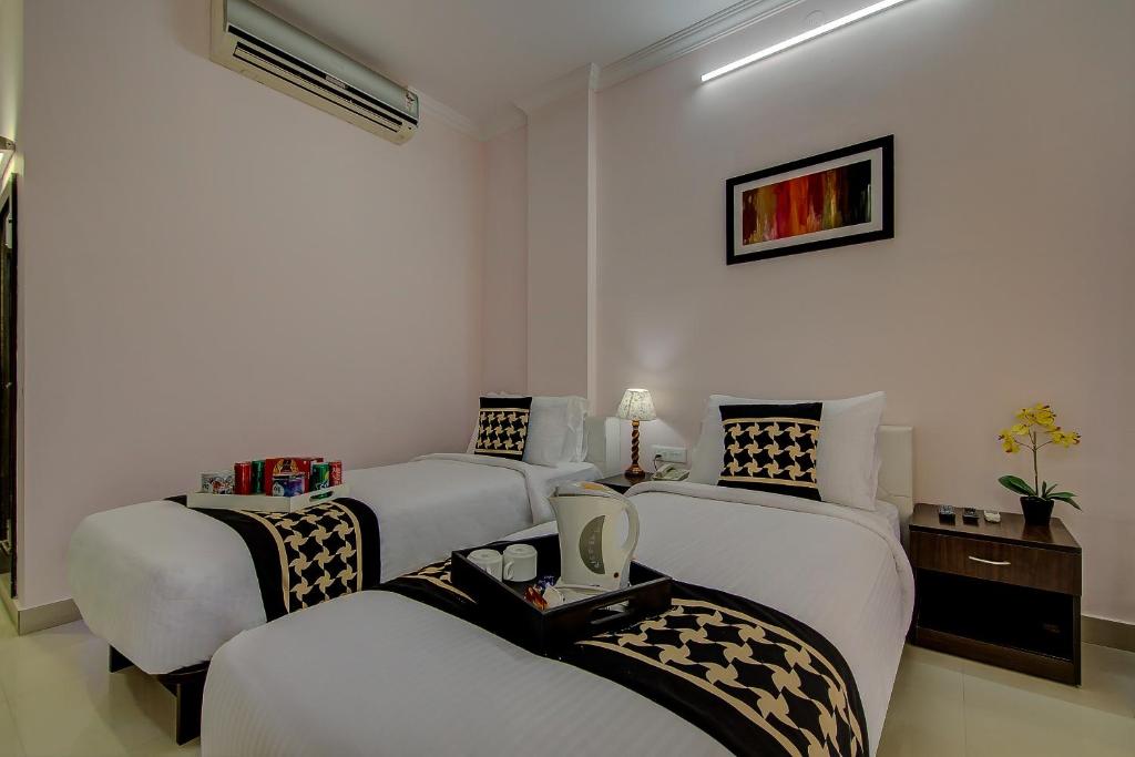 Postel nebo postele na pokoji v ubytování Hotel Krone Plaza Near IGI Airport Delhi