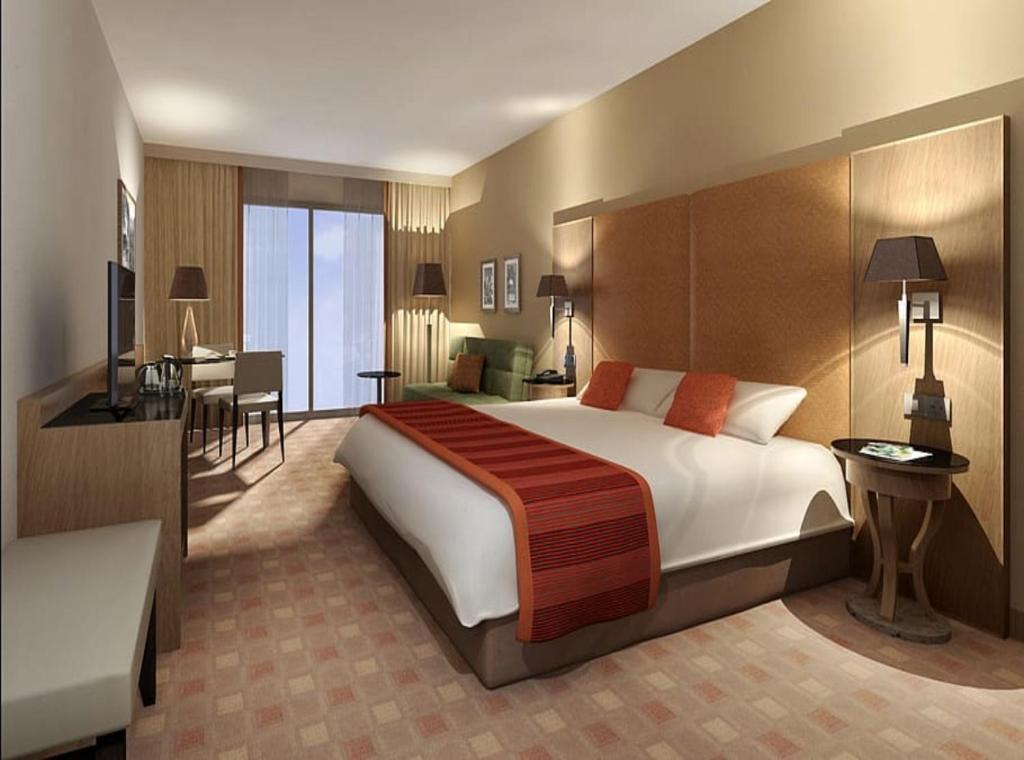 Postel nebo postele na pokoji v ubytování Hotel Grand Haven wood suites Delhi Airport