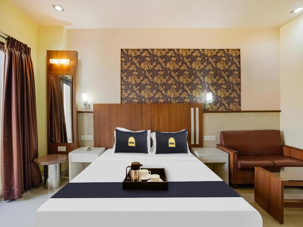 Postel nebo postele na pokoji v ubytování Hotel Grand le mount