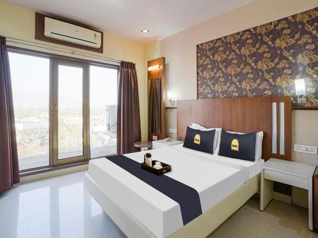 Postel nebo postele na pokoji v ubytování Hotel Grand le mount