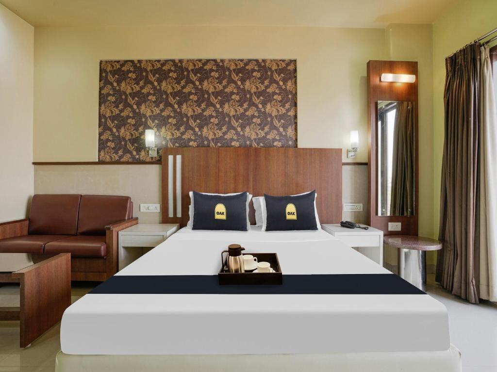 Postel nebo postele na pokoji v ubytování Hotel Grand le mount