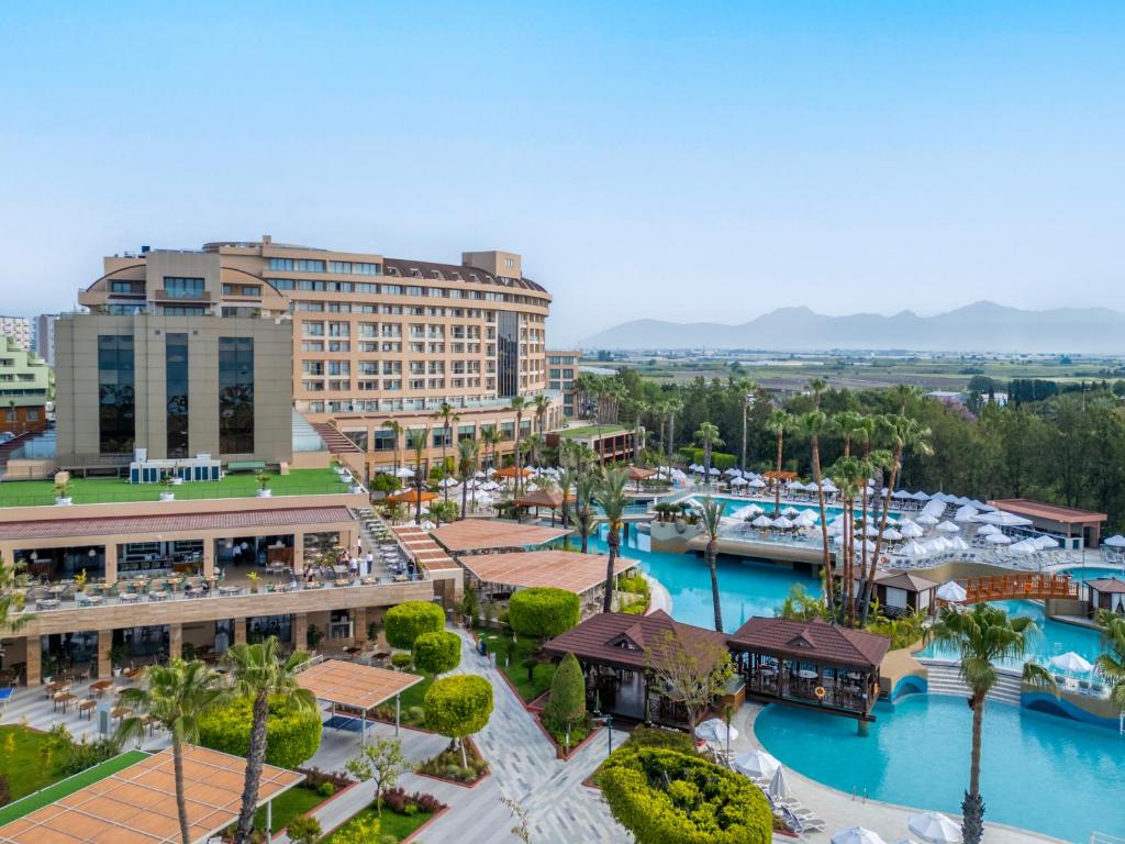 an aerial view of a resort with a marina at Fame Residence Lara & Spa in Lara