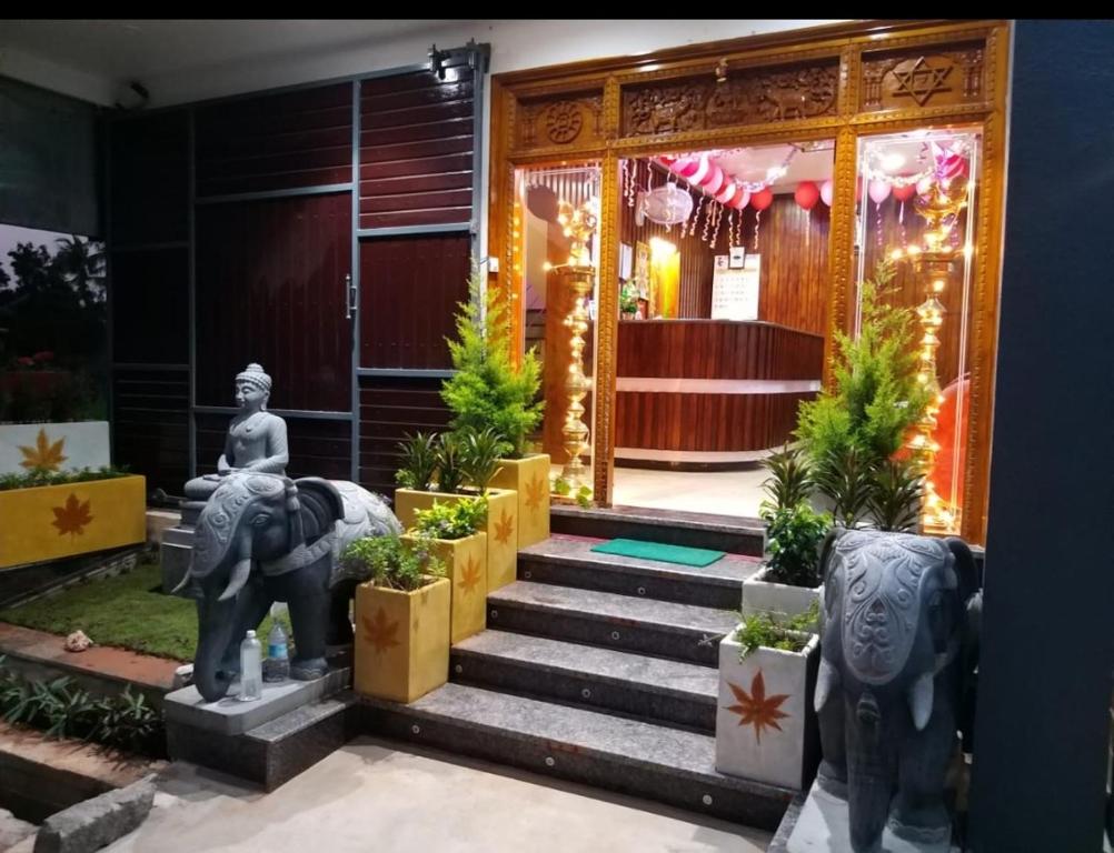 a entrance to a building with an elephant statue at Paradise Mystic Tones in Auroville