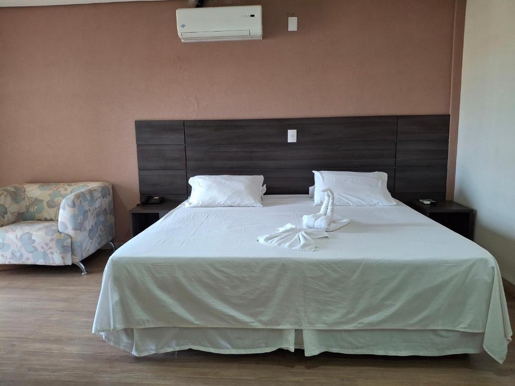 Postel nebo postele na pokoji v ubytování Ônix Inn Hotel Cravinhos
