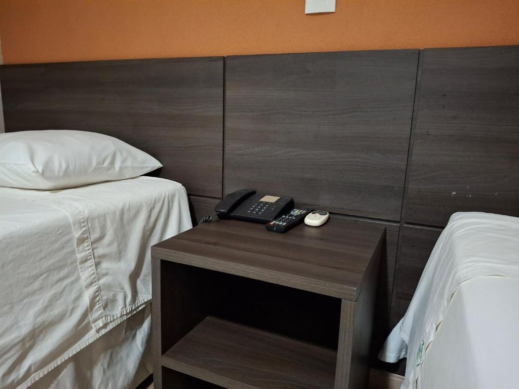 Postel nebo postele na pokoji v ubytování Ônix Inn Hotel Cravinhos