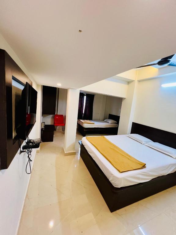 Postel nebo postele na pokoji v ubytování COSMO LODGE