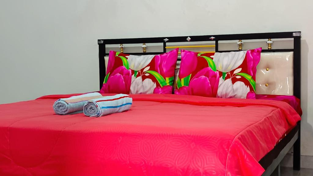 Ένα ή περισσότερα κρεβάτια σε δωμάτιο στο Odentick Homestay