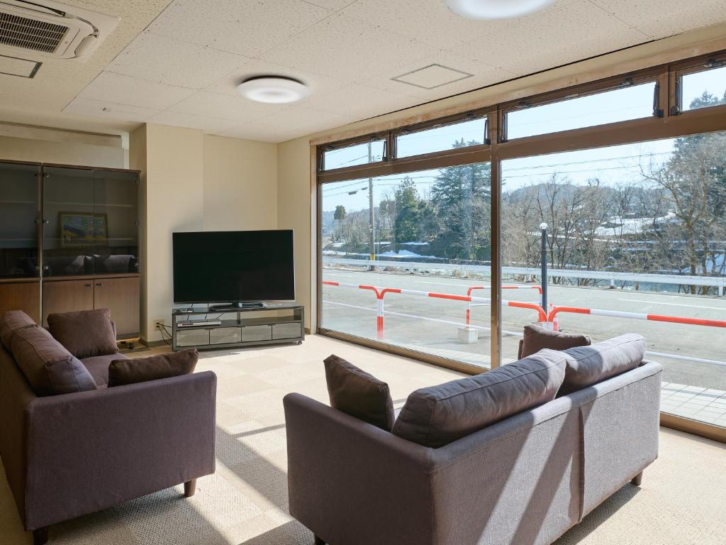 TV a/nebo společenská místnost v ubytování Owara View Hotel