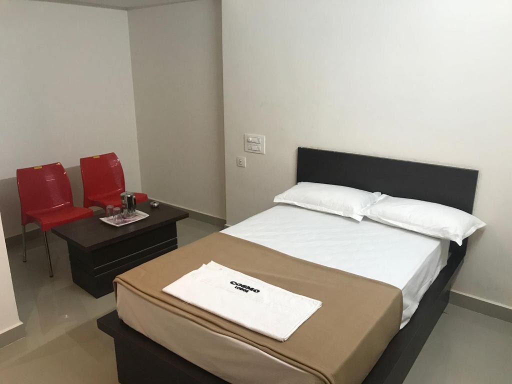 Postel nebo postele na pokoji v ubytování COSMO LODGE
