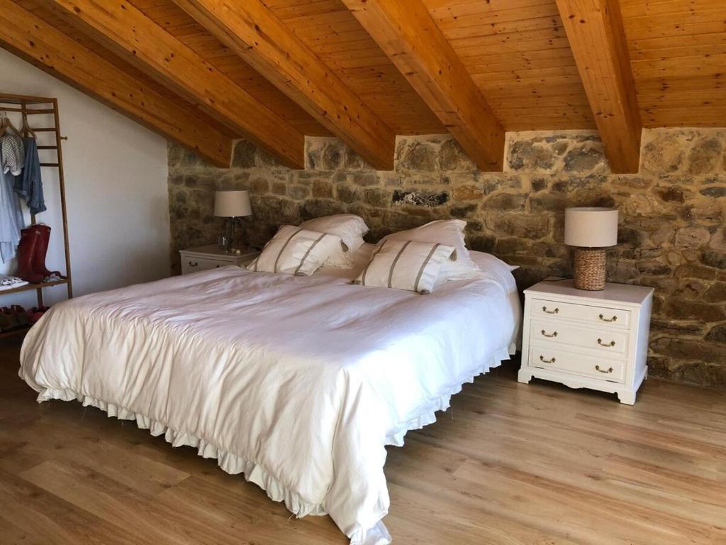 Postel nebo postele na pokoji v ubytování La Casuca De la Iglesia