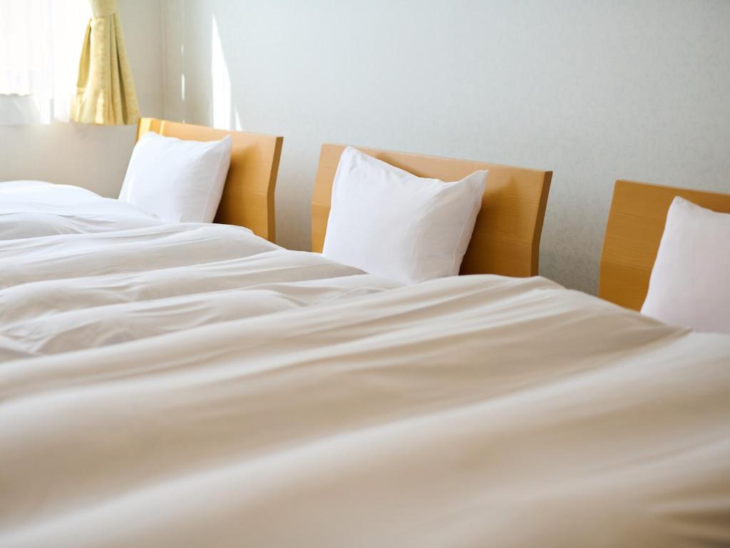Postel nebo postele na pokoji v ubytování Owara View Hotel