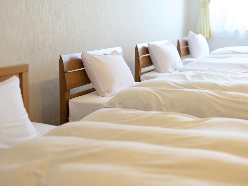 Postel nebo postele na pokoji v ubytování Owara View Hotel