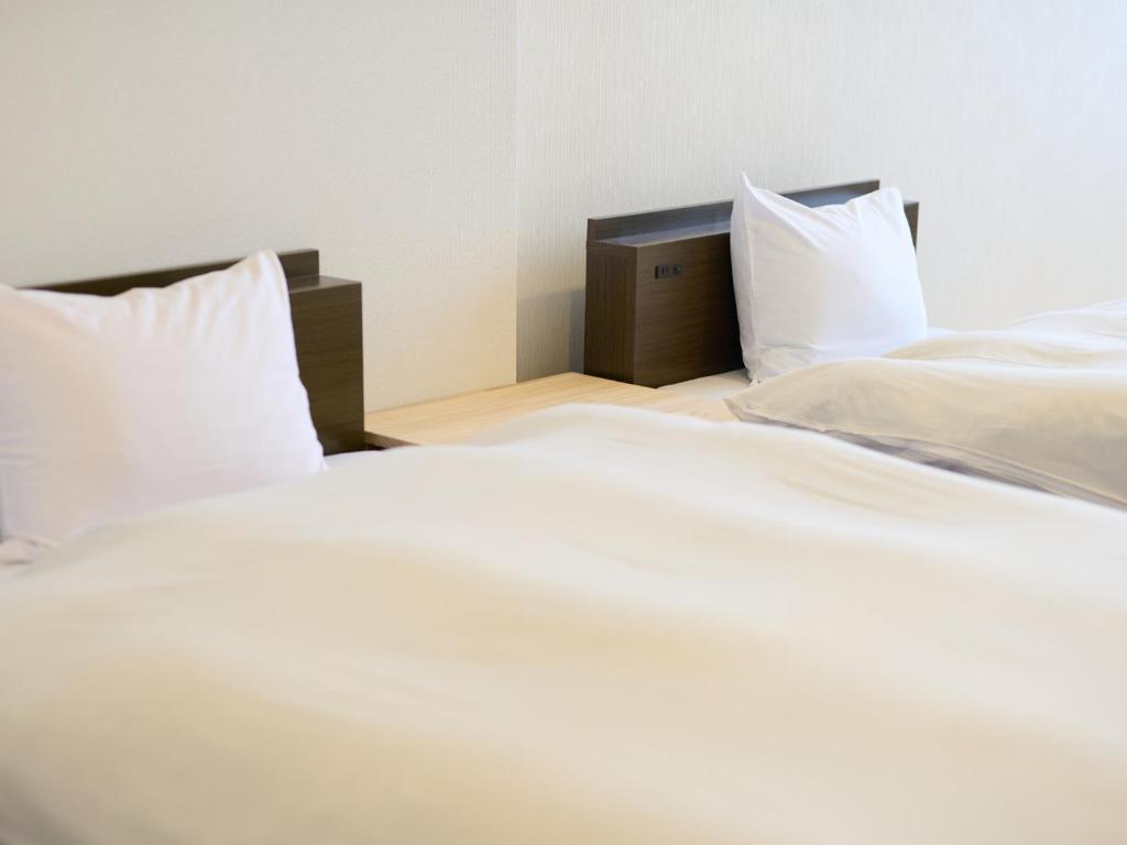 Postel nebo postele na pokoji v ubytování Owara View Hotel