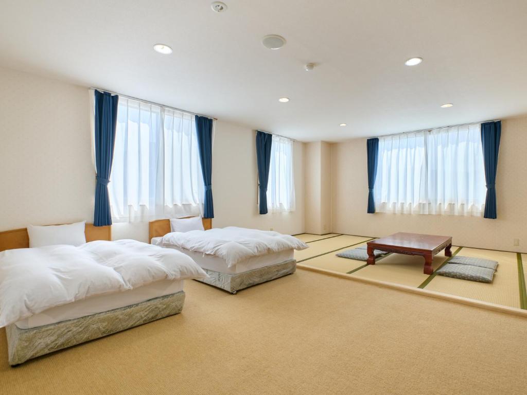 Postel nebo postele na pokoji v ubytování Owara View Hotel
