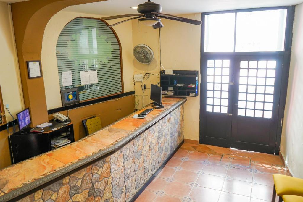 Kuchyň nebo kuchyňský kout v ubytování OYO Hotel Plaza Veracruz Centro Historico