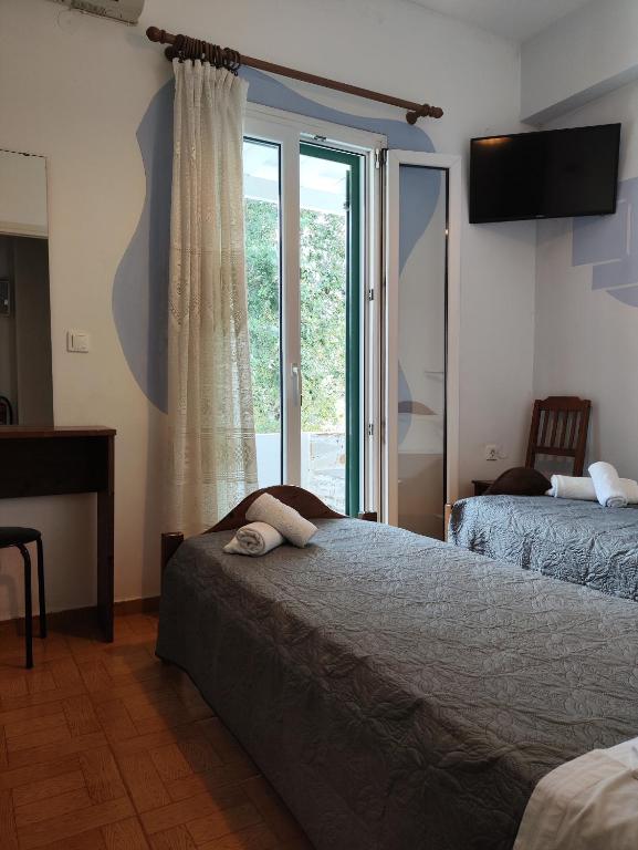 Postel nebo postele na pokoji v ubytování Niki Rooms
