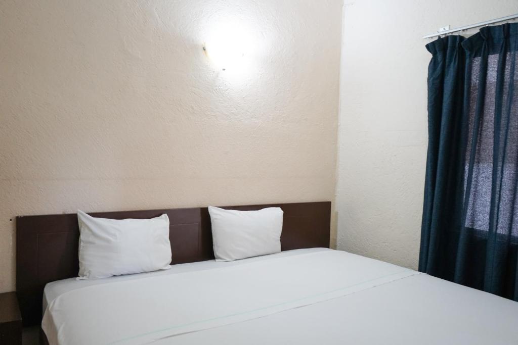 Postel nebo postele na pokoji v ubytování OYO Hotel Plaza Veracruz Centro Historico