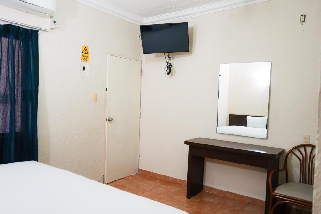 TV a/nebo společenská místnost v ubytování OYO Hotel Plaza Veracruz Centro Historico
