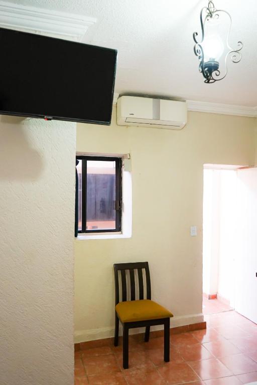 TV a/nebo společenská místnost v ubytování OYO Hotel Plaza Veracruz Centro Historico