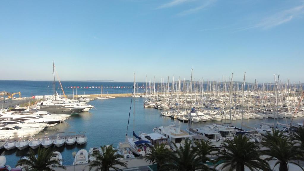 a bunch of boats parked in a marina at Port de Hyères Terrasse vue mer parking privé 2 SDB plage à pied in Hyères