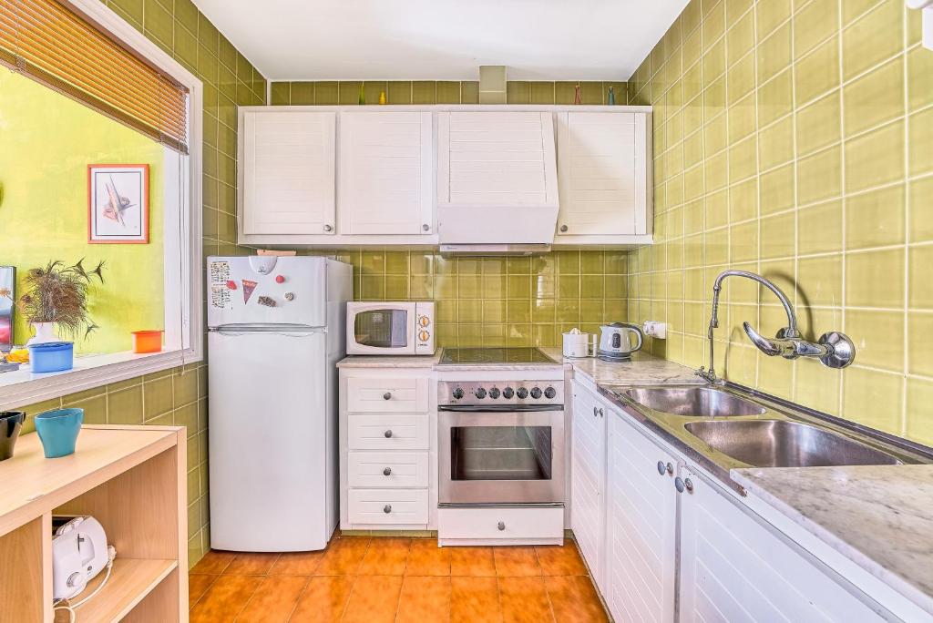 Kuchyň nebo kuchyňský kout v ubytování Apartamento Rose
