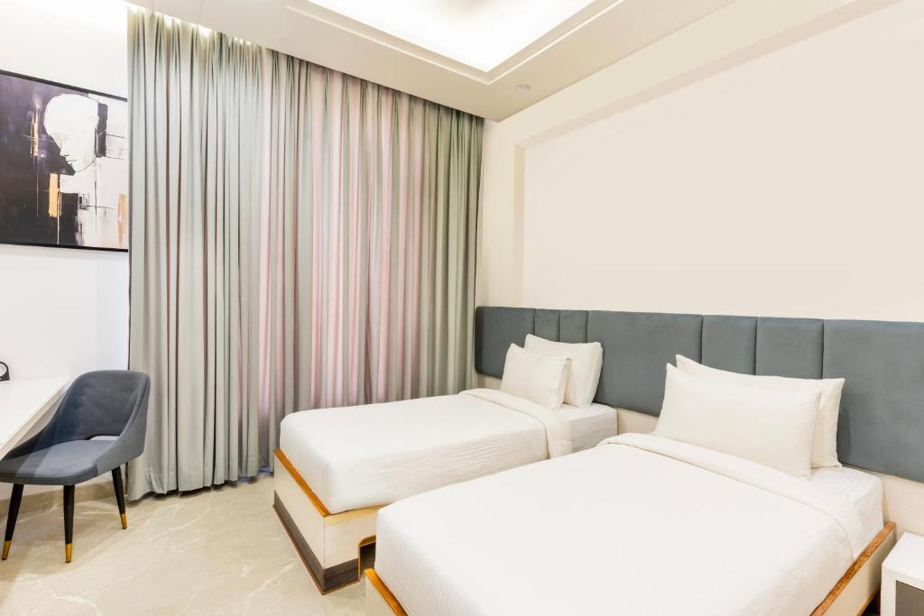 Postel nebo postele na pokoji v ubytování Hotel Elinor By Dazzling Hotels & Resorts