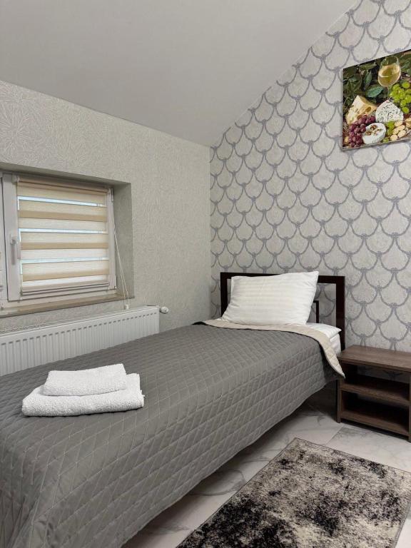Postel nebo postele na pokoji v ubytování Hotel ELYSIUM