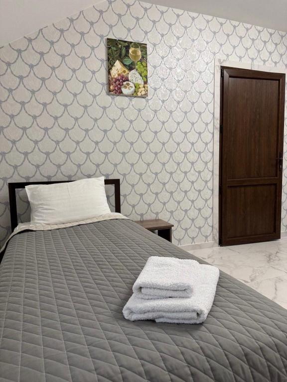 Postel nebo postele na pokoji v ubytování Hotel ELYSIUM