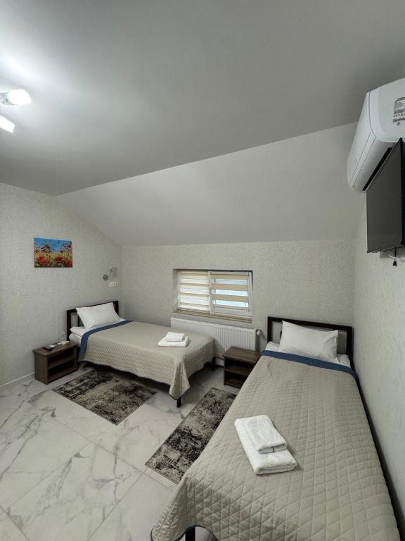 Postel nebo postele na pokoji v ubytování Hotel ELYSIUM