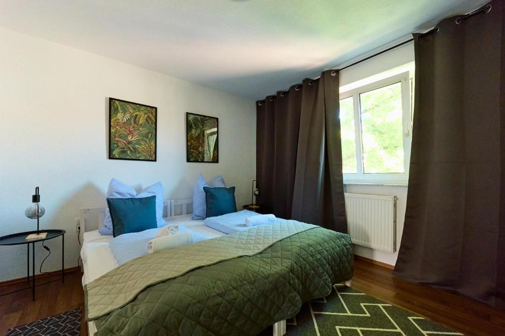 Ένα ή περισσότερα κρεβάτια σε δωμάτιο στο Apartment mit 3 Schlafzimmer- Stadtmitte