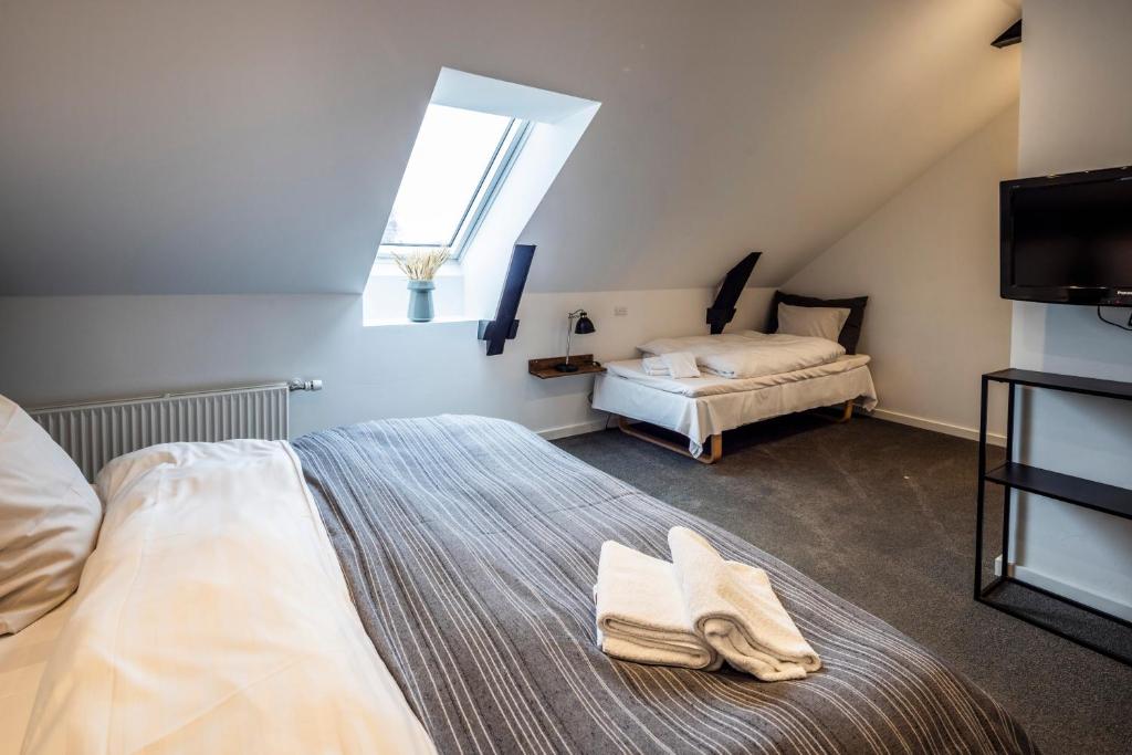 Postel nebo postele na pokoji v ubytování Hotel Birksø