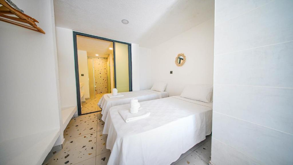 Postel nebo postele na pokoji v ubytování Thanos Hotel