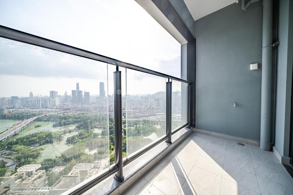 Balkón nebo terasa v ubytování Kingkey Shuibei International Apartment Hotel