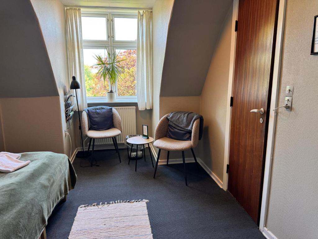 Postel nebo postele na pokoji v ubytování Gredstedbro Hotel
