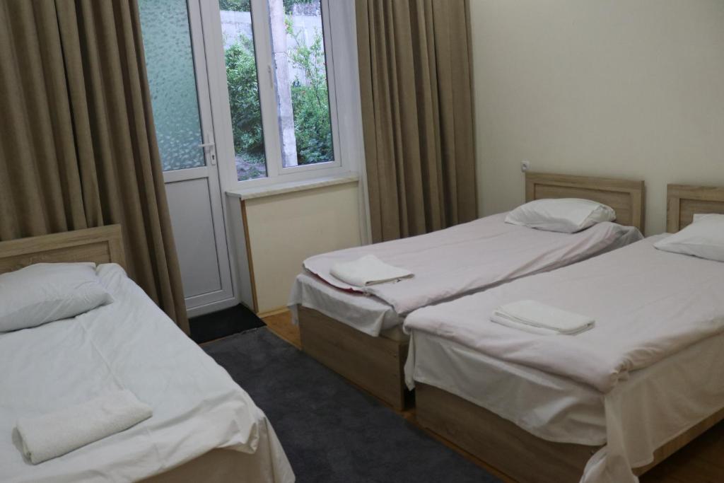 Postel nebo postele na pokoji v ubytování Guesthouse LUKA