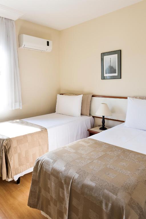 Postel nebo postele na pokoji v ubytování Central Park Flat Jardins