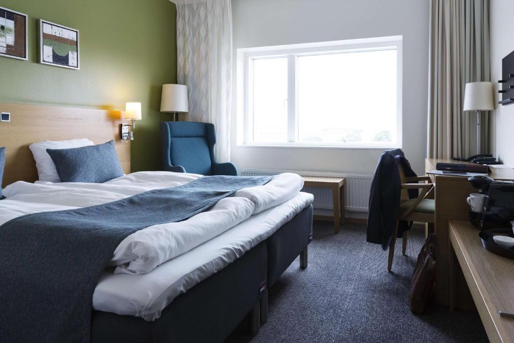 Una cama o camas en una habitación de Scandic Aalborg City