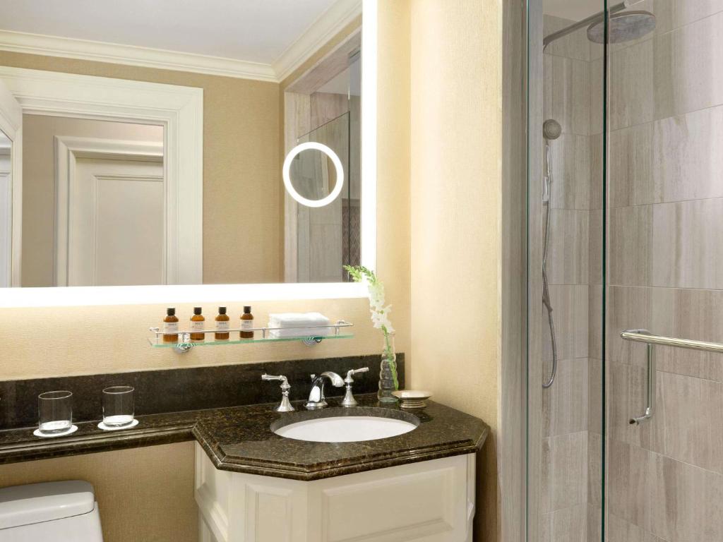 a bathroom with a sink and a shower at Fairmont Chateau Laurier in Ottawa