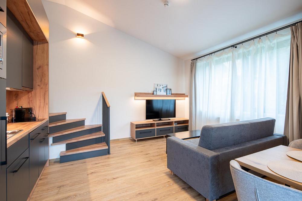 TV a/nebo společenská místnost v ubytování Resort Aurum Residence A