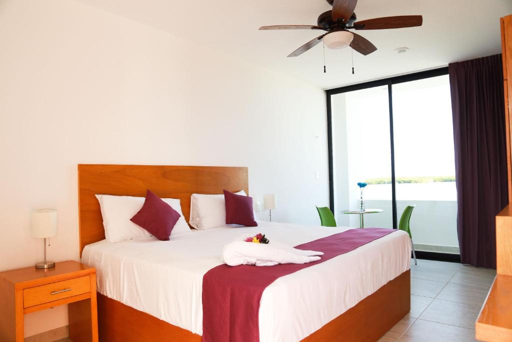Postel nebo postele na pokoji v ubytování Yuum Ha Boutique Hotel