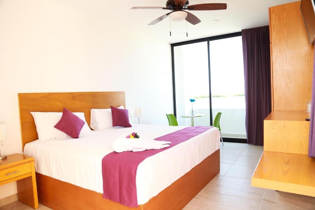 Postel nebo postele na pokoji v ubytování Yuum Ha Boutique Hotel
