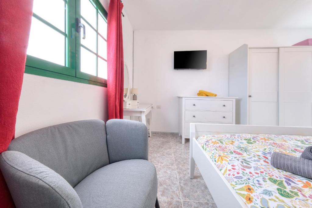 Postel nebo postele na pokoji v ubytování NoPasaNada Tu casa en Lanzarote