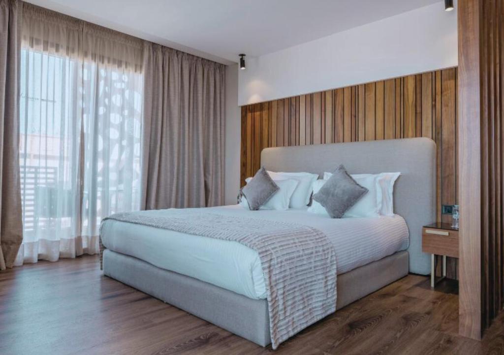 Postel nebo postele na pokoji v ubytování Longue vie Hotels