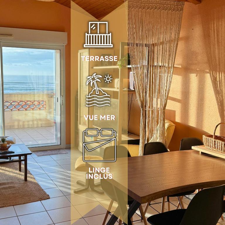 une salle à manger avec une table et une vue sur l'océan dans l'établissement La Plage - Front de mer - Terrasse - Unique, à Vieux-Boucau-les-Bains