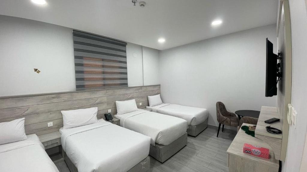 Et opholdsområde på فندق ضيافة المقام