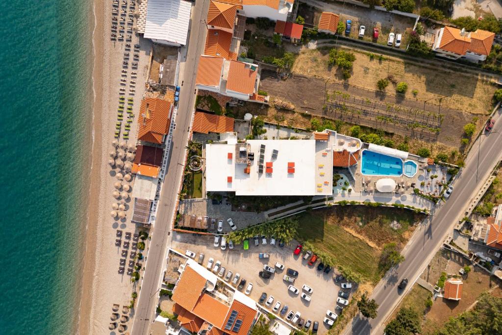 an aerial view of a beach and the ocean at Kokkari Beach Hotel in Kokkari