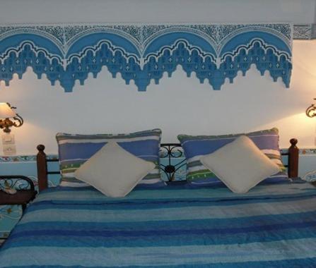 Postel nebo postele na pokoji v ubytování Le Riad Meknes