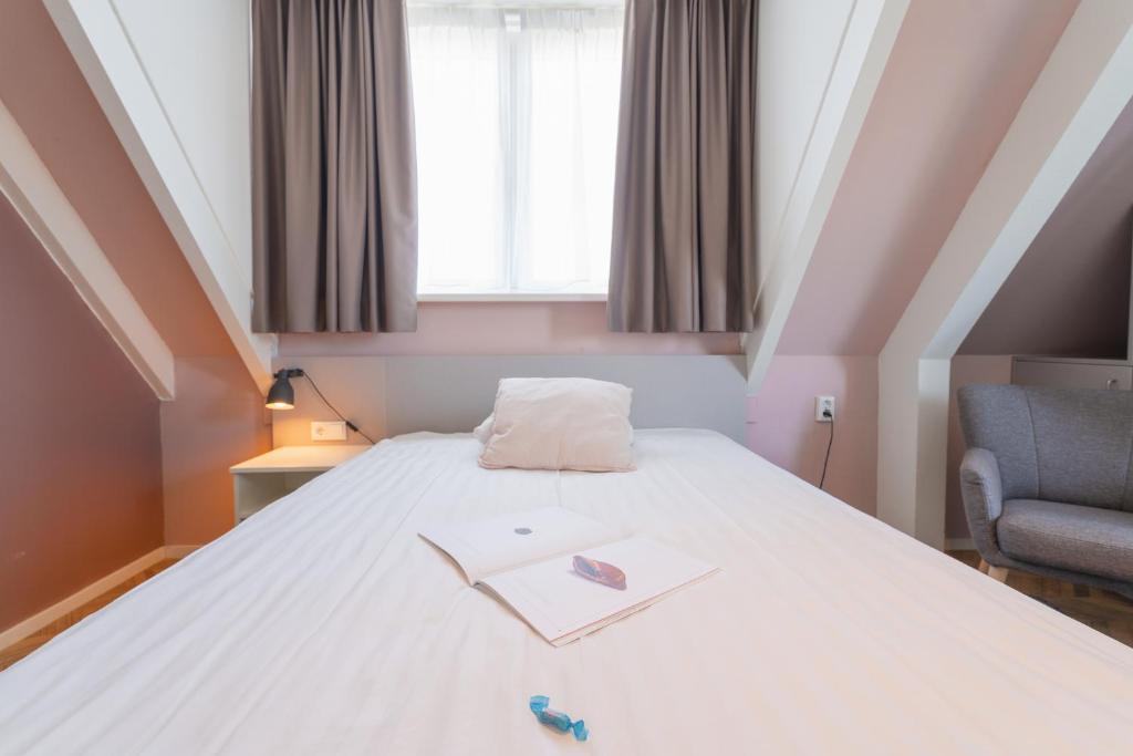 Postel nebo postele na pokoji v ubytování Hotel In den Brouwery