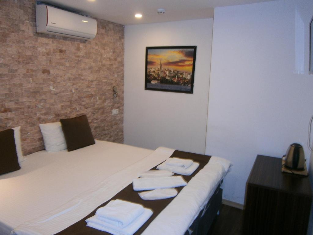 A bed or beds in a room at Nos Istanbul