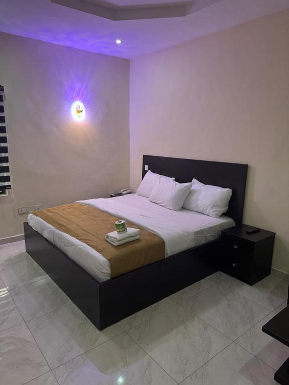 Postel nebo postele na pokoji v ubytování Golden Hits Hotel and Suites